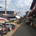 Local vendors and pedestrians on a busy street in Managua, Nicaragua