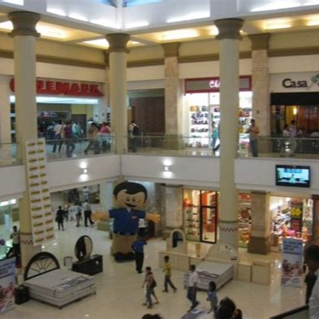 Interior of Metrocentro mall in Managua, Nicaragua, showing stores and shoppers near Managua Inn